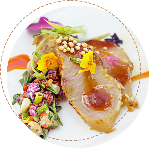 A plate of food with flowers on it.