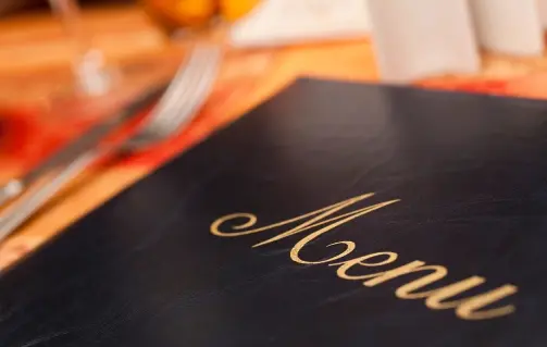A close up of the menu on a table